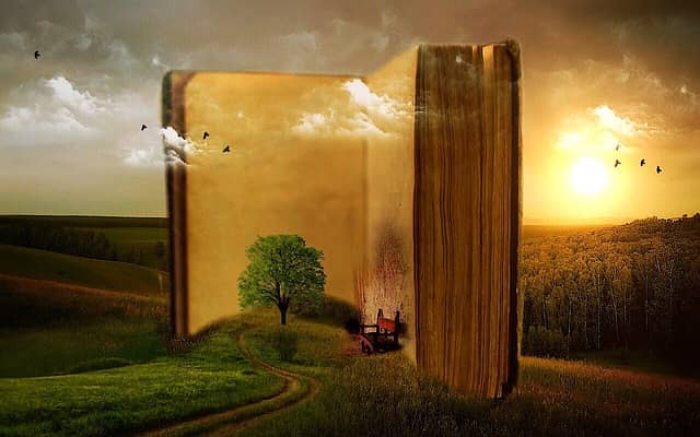 Made up image of a giant open book in the middle of the countryside. Storytelling is key to successful DDD Event Storming