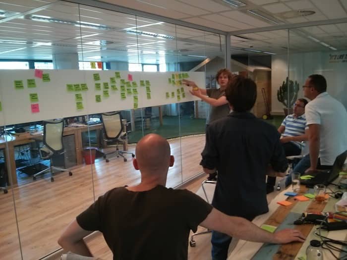Photo of an event storming. This workshop grew out of the DDD community and is an accelerator to share knowledge between domain and technical experts. As technical experts, Data Scientist should benefit from it too!