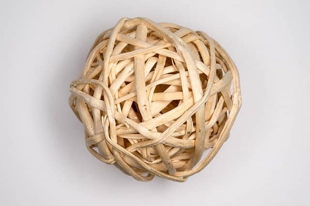 Woven wicker ball, that seems impossible to untangle. Finding where to start in a new product is a riddle of its own. Event Storming and DDD get collective intelligence to the rescue.