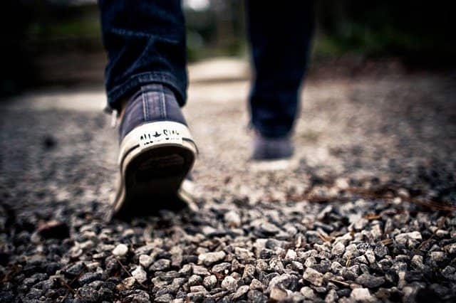 Photograph of someone walking. Gemba, or walking in the team's shoes, is a powerful change management recipe that can help you to understand the special challenges that the team is facing. This will help down the road to manage the team's resistance to change.