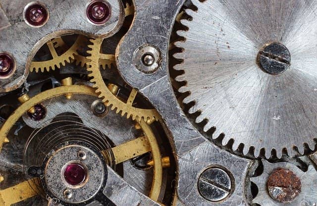 Photo of the inner gears of a clock. As a member of your current organization, you already know many of its inner working. You can use this at your advantage to get technical coaching started.