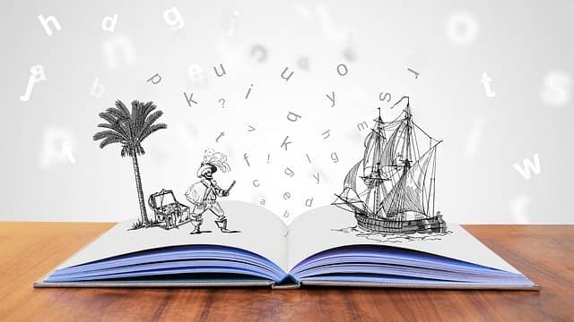 Picture of an opened book with drawings of a pirate and a ship getting out of the book. Here is a one of my success story with Example-Mapping.