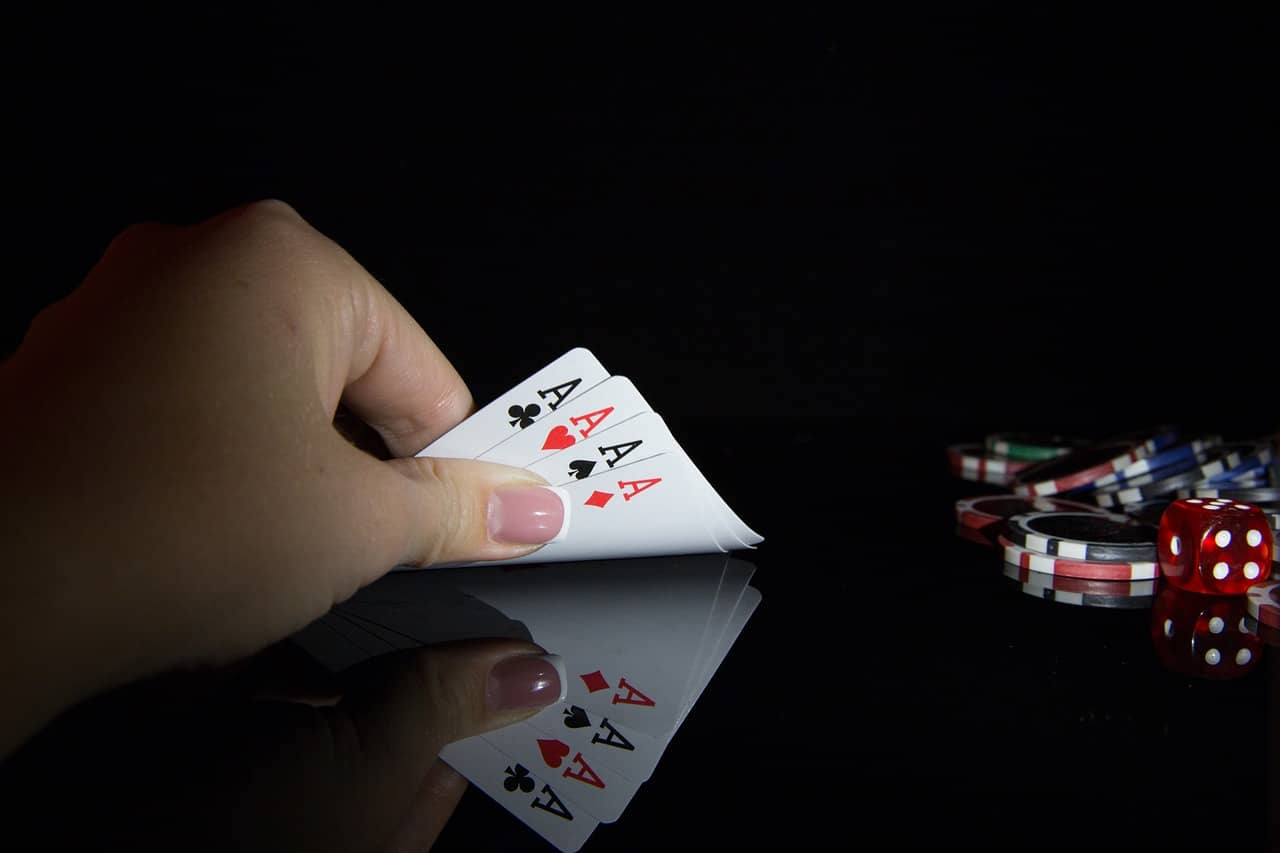 Picture of a four aces poker hand that only the owner knows. There is no point playing against this hand. Sometimes developers feel that planning poker is a game they always lose!
