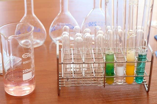Photo of chemistry material, showing different test tubes with different colors, resulting from different experiments. The goal of the mob programming code retreat is to experiment different rules for mobbing so that the team can find their preferred way.