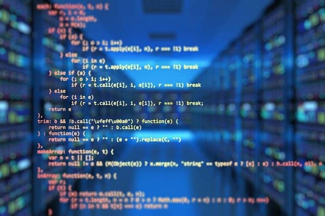 Picture made up of some code samples over a data-center. Infrastructure-as-code has become ubiquitous in our industry, and is actually a must-have for serverless development.