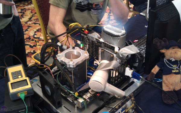 An overclocked motherboard working with extra fans and cellar tape