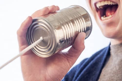 Someone yelling in a kid's 'can-phone'