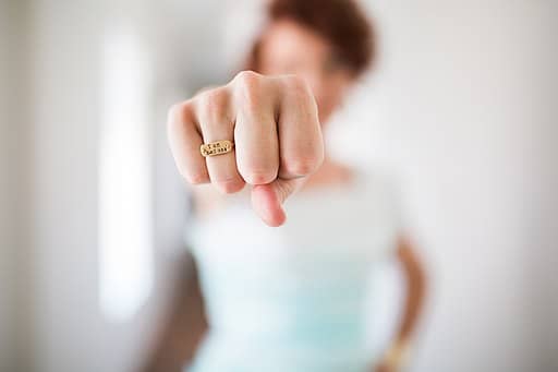 A close up on a fist wearing a ring written 'I am Badass'. Badass programmers know when to say 'No'