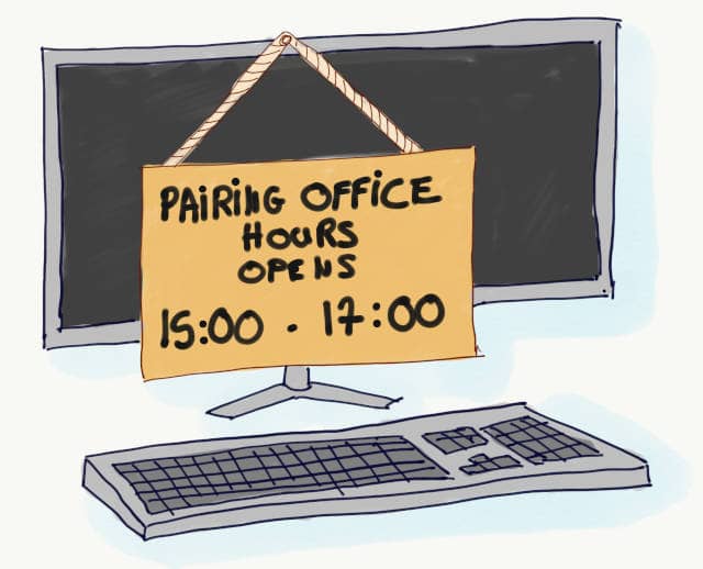 Drawing of a sign stuck on a computer screen where we can read "Pairing Office Hours Opens 15:00-17:00. Office hours are a great way to reduce task switching for tech leads.