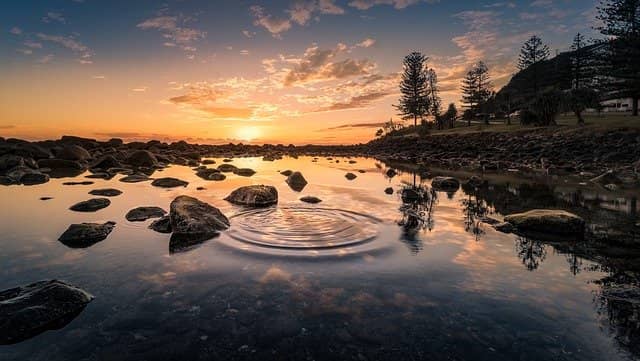 Photo of ripples on a still lake. Without some form of snowball effect, coaching is useless. We want changes to last after we have left the place. This still holds true, if not more, when coaching a remote team. Whenever we are pair remote coaching, we should explain the 'Why' and 'How' behind any of the previous practices to maximize their chances of being copied by other pairs.