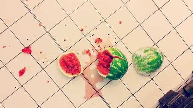 Photo of a watermelon, shattered after it fell on the floor