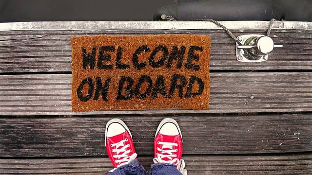 A photo of 2 feet on a capret writing "Welcome on board". We started using Quality Views at Murex to speed up onboarding.