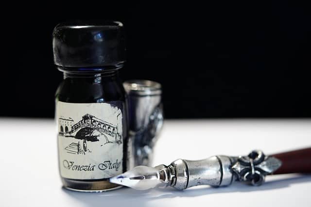 Photo of an ink bottle with a writing quill. Writing is an overlooked skill in software development, as it leads to more readable code, and more effective written collaboration.